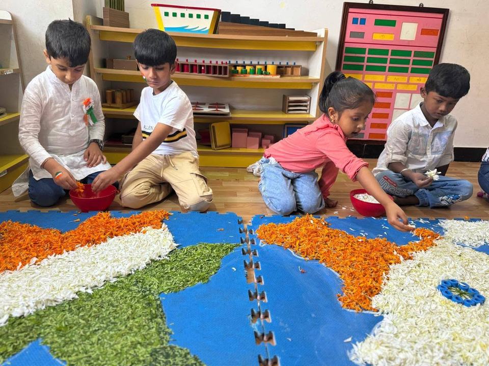Children making a flower petal collage