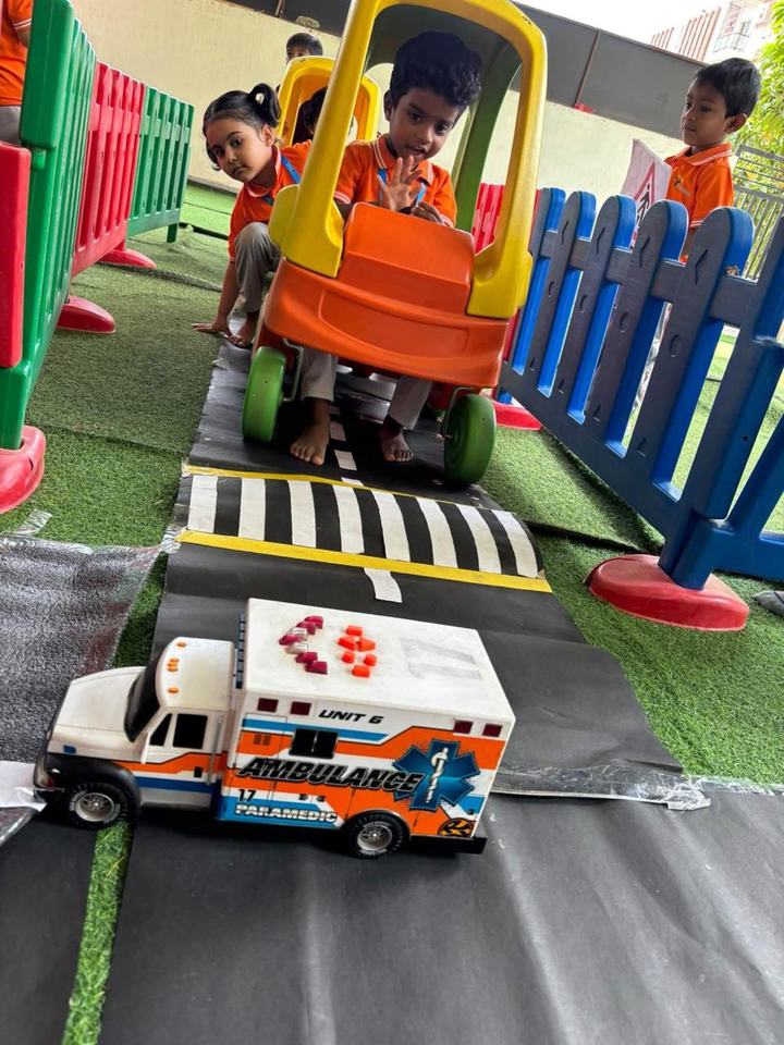 Toy car and ambulance at the zebra crossing
